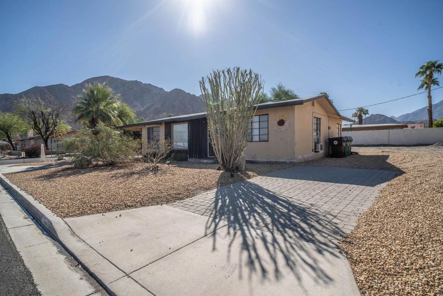 Contractor's Dream with Breathtaking Mountain Views!Perched at the top of the highly desirable La Quinta Cove, this expansive 10,000 sq. ft. lot offers endless potential to create your dream desert retreat. The existing 2-bedroom, 1-bath home, originally built in 1950, has been taken down to the studs--an ideal blank canvas for a custom rebuild or ADU.$20,000 in building plans are included, saving you valuable time and resources. With sewer already at the curb and ready for connection, much of the groundwork is in place to bring your vision to life.Surrounded by panoramic mountain views, this location offers both tranquility and convenience--just moments from hiking trails, charming Old Town La Quinta, dining, and shopping.Opportunities like this in such a highly sought-after location are rare. Build the home you've always envisioned and experience the best of desert living.
