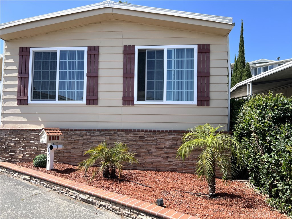Beautifully maintained and upgraded 2 bedroom 2 bath home with a peek-a-boo view located in desirable Skyline MHP. This home features vinyl plank flooring throughout, double pane windows, upgraded kitchen with island & open to the living room and dining area, upgraded bathrooms, 4" baseboard and kitchen open to the living and dining room. Mini split AC unit. Beautifully landscaped, exterior upgrades include stone front, trex flooring on front landing and porch, exterior shutters & fencing, 2 sheds and great location towards top of hill with a peek-a-boo view from your Living Room. Completely fenced for your comfort and pets. Skyline MHP offers such amenities heated pool and jacuzzi, lots of activities and large community room. Great location across the street from Rolling Hills Plaza with features AMC theater, Whole Foods, Trader Joes, Starbucks and lots of restaurants.
