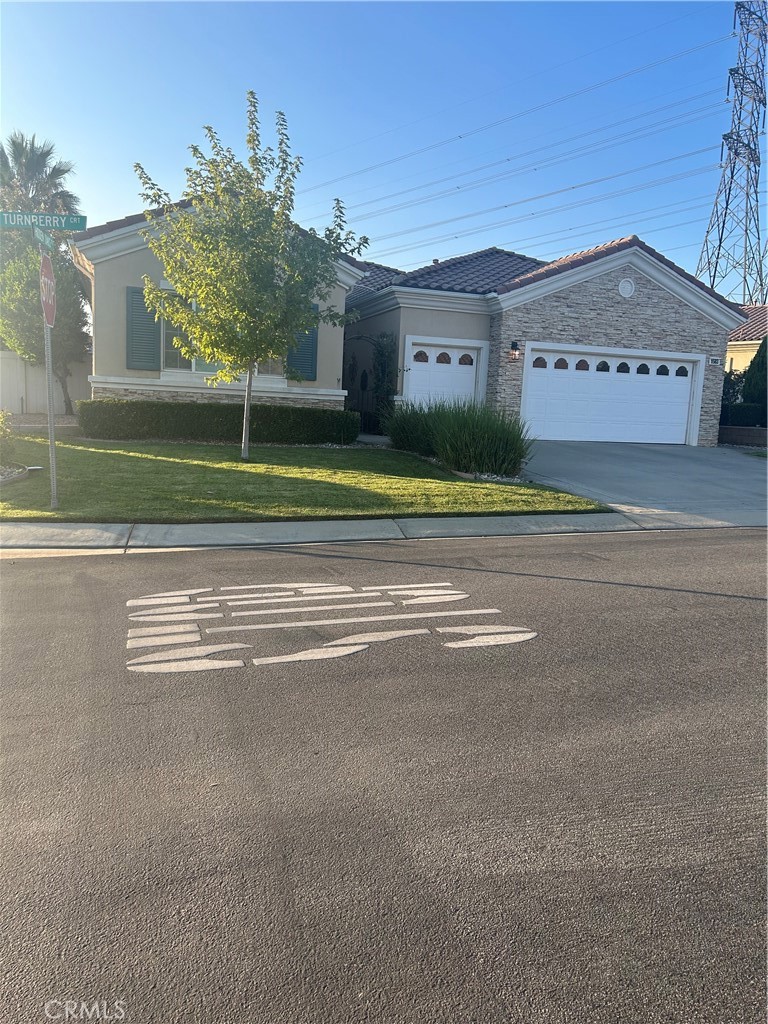 "Emerald" model at Solera, a 55+ active adult community , nice corner lot in a cul-de-sac with ample parking for family or friends visiting. Fresh and cozy latticed walkway that leads to the entry way. House offers 2 bedrooms, plus a bonus room used as an office with built in shelves and plenty of cabinets for storage. The kitchen cabinetry has been updated with new paint, quartz countertops as well as the large island where family and friends gather on special occasions. Stainless steel appliances, double oven that can also be used as convection, air fryer, and more. The formal dining area with lots of natural light makes it cozy yet formal for any social event or holidays. Step into the primary suite with a spacious primary bathroom, and a custom walk-in closet. The guest bedroom with a picture window, walk in closet, plus a Murphy bed tucked away and only pulled out when company comes over. The full and spacious guest bathroom, as well as the third half bathroom have been recently updated with new lighting, mirror, faucets hardware, and flooring. You walk out to the backyard and find a covered patio with a fan featuring speaker bulbs, here you can sit and relax , enjoy the cool evenings listening to music, or just being quiet. This house also has ample aluma-wood patio covering all through the back of the house. The backyard has mature trees: plum, lemon, apple, fig. and strawberry a blackberry patch. A water feature sits in the corner of all this quietness. Don't forget the plantation shutters covering all windows except for the kitchen window. This impressive house is available for viewing now. Take a look today!