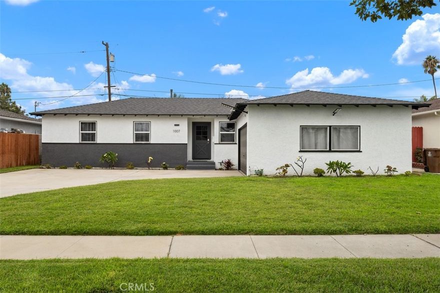 Discover the epitome of modern comfort in this stunning 4-bedroom, 2-bath completely remodeled and fully furnished home in the heart of Anaheim, California. Step into a chef's dream kitchen boasting sleek marble countertops, a gorgeous black tile backsplash, premium stainless steel appliances, and brand-new soft-close cabinets designed for effortless elegance. Retreat to the expansive master bedroom, complete with abundant closet space and a spa-like remodeled master bathroom featuring contemporary white and grey palettes accented by striking black highlights. Three additional guest bedrooms offer generous closet storage, while the spacious living room flows seamlessly into a charming Arizona room that overlooks a lush, manicured lawn and expansive backyard—perfect for al fresco gatherings. Additional luxuries include convenient indoor laundry, a 2-car garage, and central A/C to keep you cool year-round. Nestled in a serene neighborhood near Servite High School, this turnkey gem provides easy access to Anaheim's vibrant city amenities, including the magical thrills of Disneyland Resort and Disney California Adventure just minutes away, heart-pounding games at Angel Stadium and the Honda Center, the bustling Anaheim Convention Center for events and conventions, nearby parks like the expansive 130-acre Anaheim Hills for hiking and picnics, and the scenic Santa Ana River Trail for outdoor adventures—all within a short drive to Orange County's pristine beaches and world-class golf courses. Located conveniently close to Anaheim Regional Medical Center, Anaheim Global Medical Center, Kaiser Permanente Anaheim, West Anaheim Medical Center, & Anaheim Community Hospital, this rental is perfect for medical professionals looking for a place to call home.  This property is available for both Mid Term and Annual Lease Pricing.
