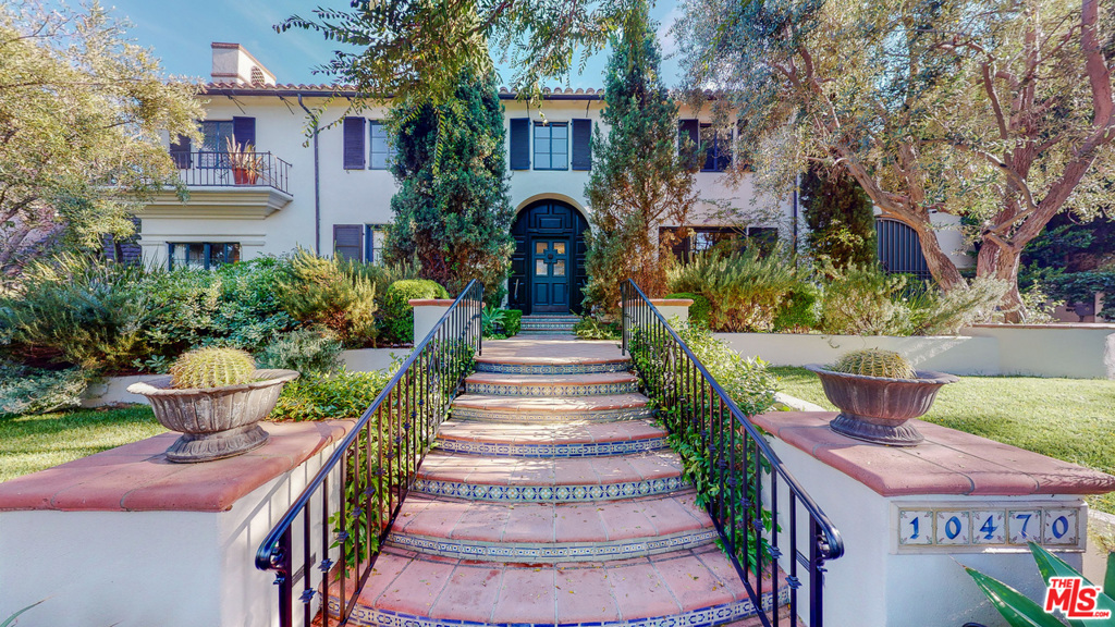 Stunning Spanish Revival located on of the best streets in very desirable Little Holmby, the house includes an updated chef's kitchen with all new appliances and hardwood floors throughout. With a traditional downstairs featuring a classic living room with high beamed ceilings and a wood burning fireplace, this Spanish Revival home is ideal for entertaining both friends and family. The house has a family room with a bar, separate dining room, comfortable study including an additional wood burning fireplace. With all four bedrooms upstairs, this elegant family home has been updated and is move-in ready. The property boasts an ideal, exquisitely landscaped, flat back yard including two entertaining patios, expansive grassy areas, a large pool, spa, and pool house. The pool house includes a gym, playroom, a bar and bathroom ample room to easily convert into an additional living space.