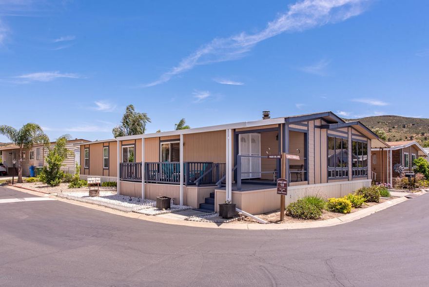 HUGE Triple Wide Home 2140sq.ft. Bigger than most single family homes but w/out the property taxes... Located in the very desirable family friendly Villa Del Arroyo Community. Home features 3/BR,2/BA Central A/C, Spacious Kitchen w/ ample counter & cabinet space, w/ adj. laundry room & pantry open to Family Room w/ vaulted ceilings, tinted windows, sit at wet bar & fireplace. Double Door entry steps down to Living Room/Dining Room w/ built-in-china hutch. Large Master Bedroom, 2 mirrored wardrobe w/ a door out to a raised private porch, Master Bath has soaking tub, separate shower, duel vanity. Large raised covered deck w/slider to Living Room. Home sits on a large 4462 sq ft corner lot with views of the hills. Attached Covered Carport w/ parking for 4 cars. Drought free/drip landscaping, 2 sheds for storage. Community offers a variety of amenities; pool, spa, clubhouse, tennis, basketball & sports courts, walking trails, bike path, billiard, ping-pong, library & there is optional RV storage area.