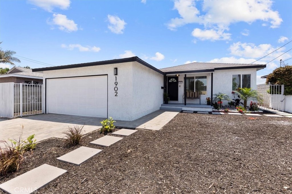 Beautifully updated 3-bed, 1-bath home on a 5,138 sq. ft. lot with 1,040 sq. ft. of living space. Features a new HVAC system, tankless water heater, vinyl plank flooring, and a fully remodeled bathroom with modern tile. The kitchen features new cabinets, quartz countertops, and stainless steel appliances. Enjoy the cozy electric fireplace with mounted TV. The spacious backyard includes clean stepping stones around the home and is ideal for entertaining or future expansion—perfect for an ADU or a pool. Attached garage. Great curb appeal and located near freeways, transit, shopping, and LAX. Turnkey and move-in ready!