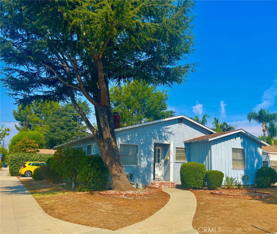 Nestled close to schools, shopping and freeways this mid-century SFR is a charming blank canvas with a lot of room to expand. From the Bevis Ave. entry one is greeted with a view of the beautiful hardwood floors throughout, opening up into the living room and dining area. A gas operated, tile faced, fireplace is situated on your left with an ample amount of windows for a bright airy setting, and recessed lighting for those short winter days. An exit door from the living room leads to the back yard which is primarily a low maintainance cement decked area. Plenty of room for RV parking through the double gate off the alley, and still enough room for an ADU! All three bedrooms contain adequate closet space for storage, as do the linen closets in the hallway. The kitchen is roomy enough for more than one cook during the holidays and the stove (with double oven) stays with the property. A service porch off the kitchen (with washer and dryer that stay with the property) leads to a second entrance on Hatteras St. The double garage is just adjacent to this entrance, so no long walks carrying shopping bags in from the car. All that is needed is a buyer with some imagination and the ability to look ahead at what wonderful possibilities present themselves.