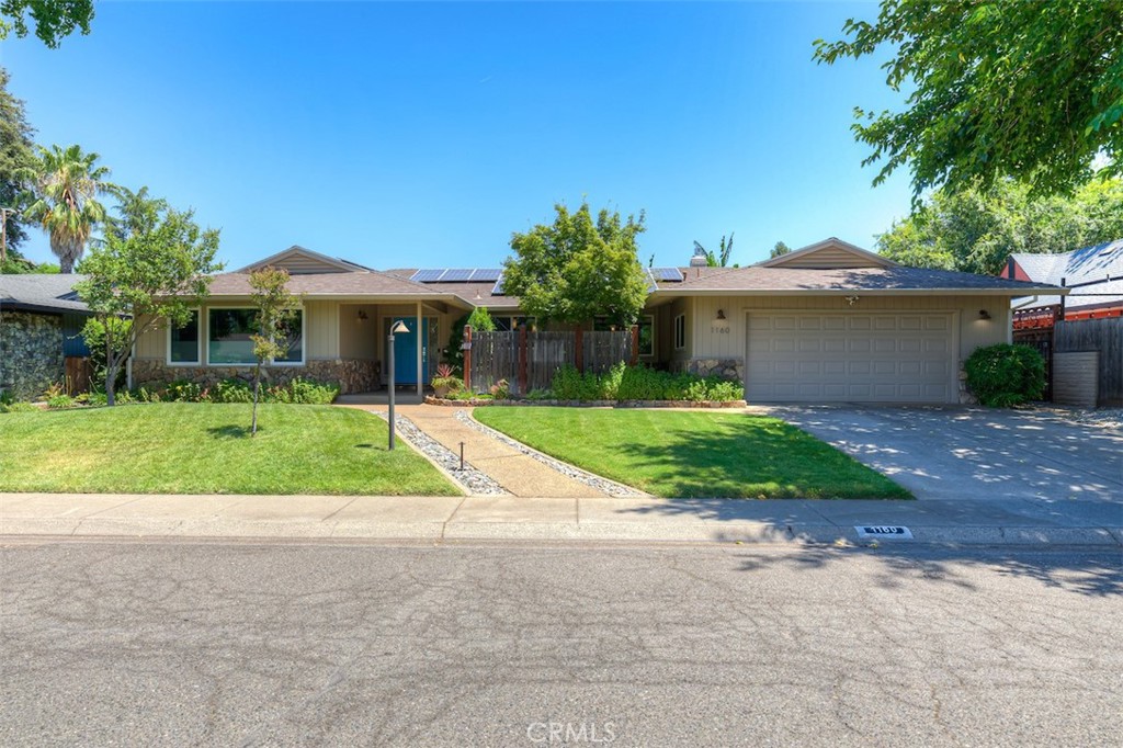 Welcome to 1160 Kentfield Road, situated on one of Chico’s most sought-after and iconic streets. This prime location offers easy walking access to Chico’s parks, schools, and coffee shops, along with convenient freeway access just moments away.This beautifully updated 3-bedroom, 3-bath home offers 2,570 square feet of refined living space. Step inside to discover rich wood flooring and timeless wainscoting in the dining room, blending classic charm with modern comfort.The open-concept kitchen is a true showstopper, centered around a generous island that invites gathering and functionality. It features soft-close cabinetry, Carrara marble countertops, a striking tile backsplash, and premium stainless steel appliances—including a Bertazzoni gas range with matching hood, a microwave/warming drawer, and a wine fridge—creating a chef’s kitchen designed for both beauty and performance. The master bedroom is truly stunning, featuring a spacious walk-in closet with built-in shelving, a stylish chandelier, and private access to the backyard. The spa-like ensuite bath offers double vanities and a custom walk-in tile shower, creating a luxurious retreat you'll love coming home to. The two additional full bathrooms have been egelantly updated with custom cabinetry topped with marble surfaces, designer tilework, frameless glass showers, Kohler fixtures, and refined accessories. The floor plan flows effortlessly, beginning with a formal entry that leads into spacious living and dining areas. A cozy family room showcases a custom gas fireplace and built-in cabinetry, while the oversized bedrooms, well-appointed laundry room, and generous storage throughout add comfort and convenience to everyday living. Additional highlights include owned solar, a newer roof, updated lighting, energy-efficient dual-pane windows, a 200-amp electrical panel, newer heating and cooling systems, and dual water heaters. The outdoor spaces are just as remarkable, featuring a charming front courtyard and a backyard retreat thoughtfully designed for relaxation and entertaining. Enjoy a sparkling in-ground pool set amid lush tropical landscaping, creating your own private paradise right at home. Contact your favorite Realtor to schedule a tour of this exceptional home.