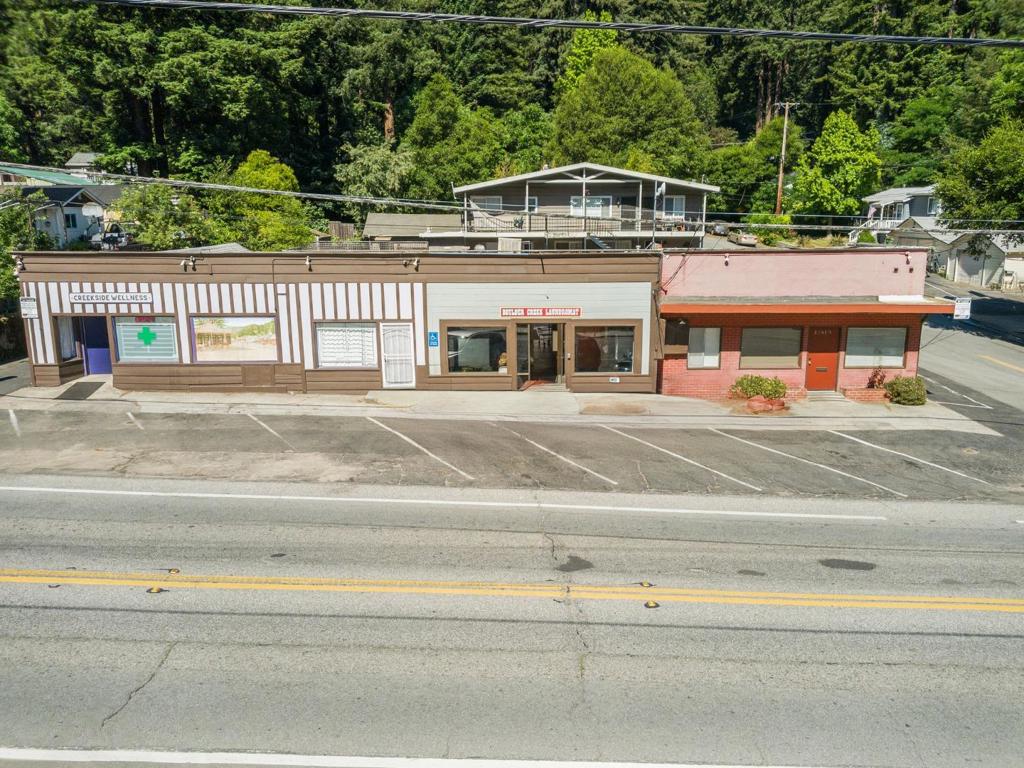 Dont miss this exceptional opportunity to own a high-visibility commercial property at the gateway to Boulder Creek. Located directly on Highway 9, 12615 Highway 9 offers excellent exposure and flexibility for investors or owner-users alike. The property features three distinct suites and is currently partially leased to two established tenantsa laundromat and a wellness businessproviding immediate rental income. One suite, approximately 1,100 sq ft and zoned C-2, is vacant and ready for your business or a new tenant. Whether you're looking to expand your portfolio or establish your own enterprise in a prime location, this property delivers both stability and potential. A great location in the heart of the San Lorenzo Valley.