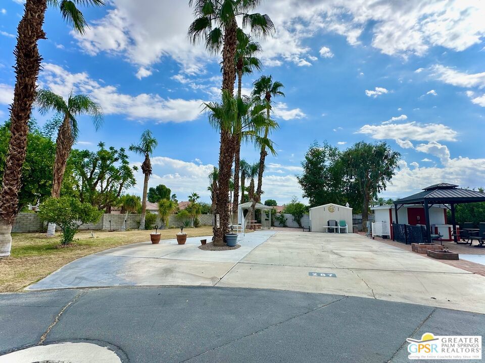 Exceptional Lot Located on the highly desirable year-round occupancy side of Desert Shadows RV Resort. This premium corner RV lot offers the rare opportunity to enjoy full-time desert living, something not available throughout the entire resort. With spectacular views of the surrounding mountains, beautifully landscaped, thoughtfully equipped with a gazebo AND shed, You won't find a condo or small home in the Palm Springs area at this price point where you own the land, making this an unbeatable value whether you're seeking a seasonal escape, a full-time residence, or a long-term investment. Desert Shadows is a vibrant gated 55+ community with 460 individually owned lots and some of the best amenities in the Coachella Valley. Residents enjoy access to six heated pools, including an Olympic-sized lap pool and an indoor pool, along with spa and sauna facilities. The resort also features sunken, lit tennis and pickleball courts, indoor shuffleboard, a full gym, a woodshop, card and hobby rooms, a putting green, a dance studio, multiple picnic areas, and a grand 16,000 sq. ft. ballroom hosting events and activities year-round. Low monthly HOA dues of just $420 include water, trash, sewer, basic cable, clubhouse Wi-Fi, recycling services, and professional landscaping around your unit, providing both convenience and peace of mind. Don't miss out on this exceptional opportunity to own a this prime lot in one of the desert's best and most welcoming communities.