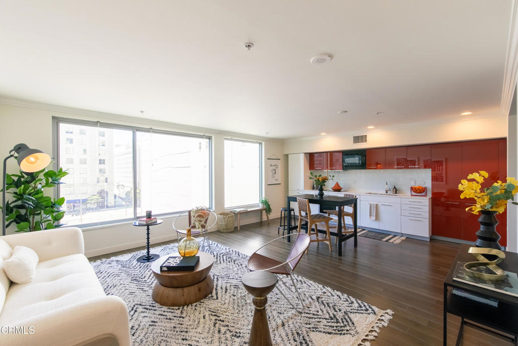 Experience the best of Downtown LA living in this chic, modern loft-style retreat. Floor-to-ceiling energy-efficient windows grace the open layout with natural light while showcasing sweeping city views. Sleek wood floors set the tone, complemented by a German-designed kitchen with Quartz countertops, a Fagor convection oven and stovetop, plus premium Bosch appliances--including an in-unit washer and dryer for ultimate convenience.Set within the sought-after Concerto building, residents enjoy resort-style amenities: a heated saltwater pool and spa, state-of-the-art fitness center with towel service, an outdoor kitchen with BBQs, two firepit lounges, a dog run, and secure subterranean parking.Step outside your door and you're immersed in the vibrant pulse of Downtown--walk to LA Live, Crypto.com Arena (Staples Center), 7th & Fig, Hotel Figueroa, Whole Foods, and some of the city's most acclaimed restaurants and nightlife.With endless possibilities at your doorstep and comfort within, this home blends luxury, lifestyle, and unbeatable value.