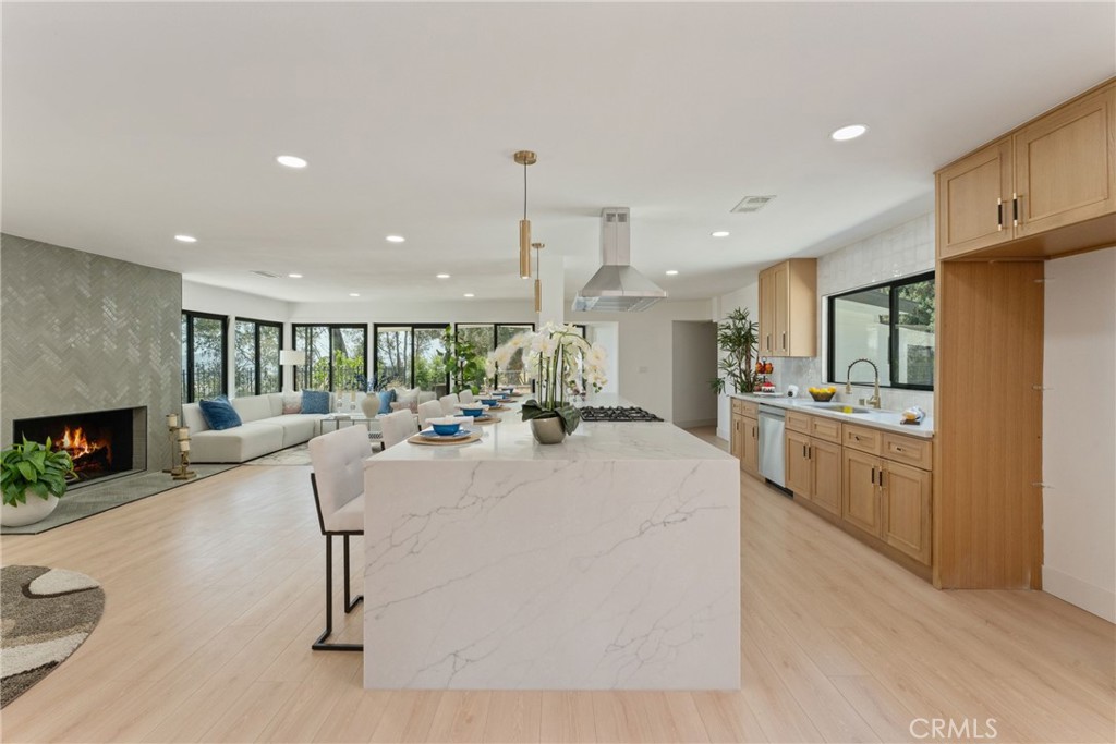 Situated high above Quail Canyon, with breathtaking, panoramic views of the entire San Bernardino Valley, your private estate awaits. This magnificent single-story home is a testament to timeless mid-century modern design, now meticulously reimagined and brought to life with the finest, most luxurious finishes of today. Every detail of this sprawling ½ acre property has been thoughtfully considered and flawlessly executed. The gourmet kitchen, a true chef's dream, boasts a complete renovation, offering a culinary experience unlike any other. The spa-like bathrooms are equally impressive, having undergone a luxurious remodel to provide a sanctuary of relaxation. Retreat to the primary suite, where a cozy fireplace casts a warm glow, complementing the stunning valley vistas that unfold before you. A dream closet, meticulously designed for the most discerning wardrobes, completes this private haven. Beyond the walls of this architectural marvel, a truly exceptional outdoor living space unfolds. A very private pool and spa view deck offer an unparalleled setting for relaxation and soaking in the majestic surroundings. The sprawling patio and hardscape create an entertainer's paradise, perfect for hosting gatherings, creating memories, and savoring the Southern California lifestyle. This is more than just a home; it's a gateway to an unparalleled lifestyle within minutes of the abundant outdoor recreation the San Bernardino region and its majestic mountains offer. This remarkable residence will impress even the most discerning buyers, offering a rare opportunity to own a piece of mid-century modern history, thoughtfully revitalized with all the finest finishes of today, and perfectly situated to embrace the natural splendor and vibrant attractions of the San Bernardino Valley and the nearby mountains.