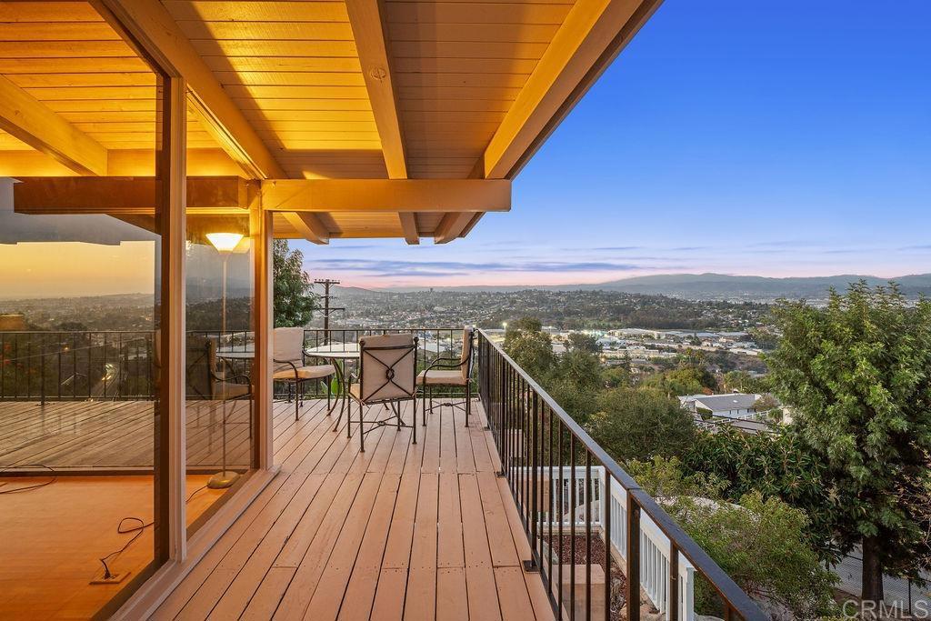 Nestled among 1.10 acres of mature fruit trees, this beautiful home enjoys one of the most fantastic panoramas Mount Helix has to offer. Delight in the view outside from the spacious sun deck or inside through the floor-to-ceiling windows. Luxury features abound inside and out of this unique home, including cedar beam ceilings in the living room, dining room, and family room, large built-in wardrobes, a spacious kitchen with Sub-Zero refrigerator, a water feature off the master bedroom and bath, and skylights that brighten the interior.