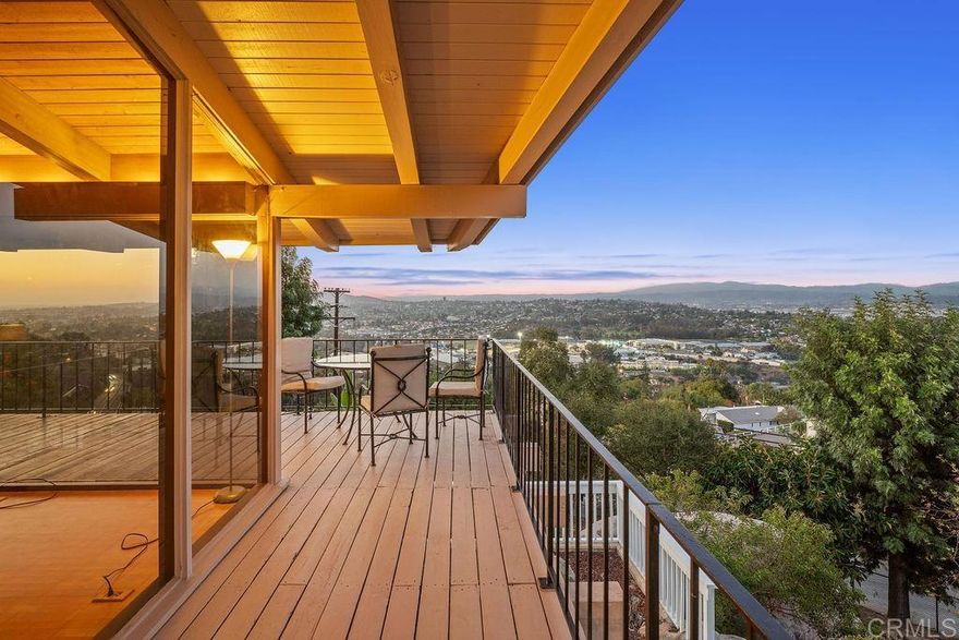 Nestled among 1.10 acres of mature fruit trees, this beautiful home enjoys one of the most fantastic panoramas Mount Helix has to offer. Delight in the view outside from the spacious sun deck or inside through the floor-to-ceiling windows. Luxury features abound inside and out of this unique home, including cedar beam ceilings in the living room, dining room, and family room, large built-in wardrobes, a spacious kitchen with Sub-Zero refrigerator, a water feature off the master bedroom and bath, and skylights that brighten the interior.
