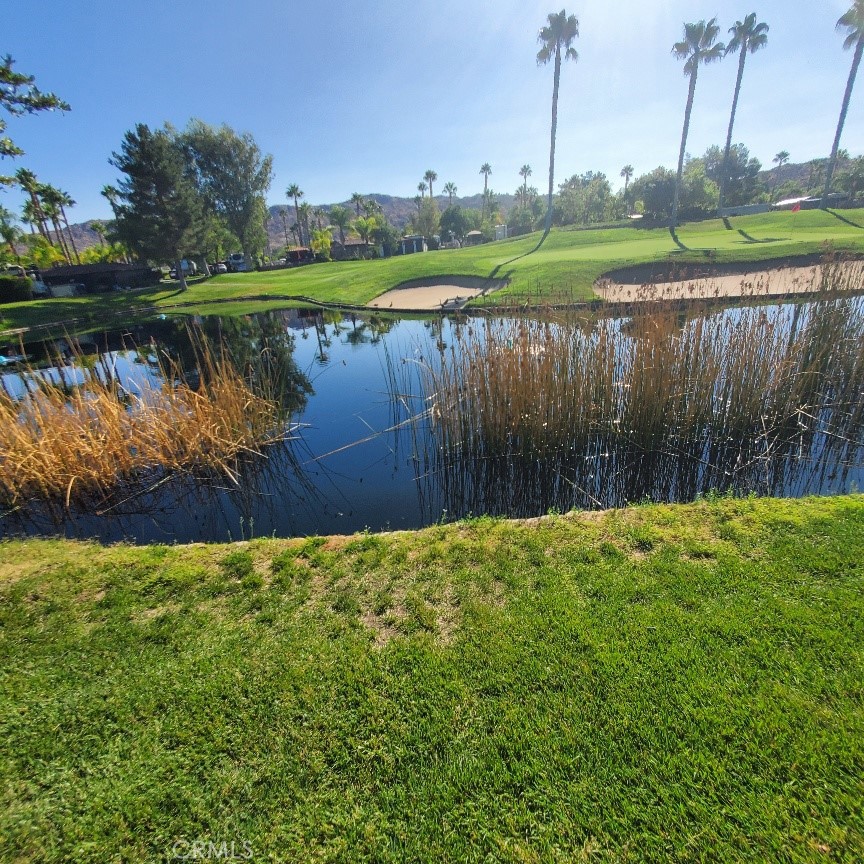Discover the perfect blend of luxury, comfort, and convenience at Lot 351, one of the best values and locations in the prestigious Rancho California RV Resort. Nestled just outside the renowned Temecula Wine Country, this prime location offers breathtaking views of the golf course fairway and tranquil lakes. Whether you're ready to retire in style or seeking a luxurious getaway, this spot is your ideal destination. Designed for relaxation and enjoyment, the outdoor living space features a built-in BBQ, refrigerator, and counter, perfect for entertaining or unwinding in nature's embrace. All that's missing is you and your RV! Known as The Ranch, 592 privately owned lots, this exclusive 440-acre gated community caters to newer Class A motor coaches, fifth-wheels, and Super C coaches. It boasts two clubhouses, a community restaurant, and a well-stocked grocery market, ensuring you have everything you need at your fingertips. Enjoy a wealth of amenities, including golf and pickleball clubs, five swimming pools, spas and shower facilities. Stay active with six tennis/pickleball courts, an exercise room, and four large laundry facilities. The 14-hole Executive (Par 3) Golf Course winds beautifully through the resort, offering a delightful challenge for golf enthusiasts. Plus, there's a dog park and Church for Sunday services. Whether you're planning to retire, escape for the weekend, or rent to fellow RV owners, Lot 351 in Rancho California RV Resort is your perfect retreat. Experience the ultimate in outdoor living and make this vibrant community your new home.