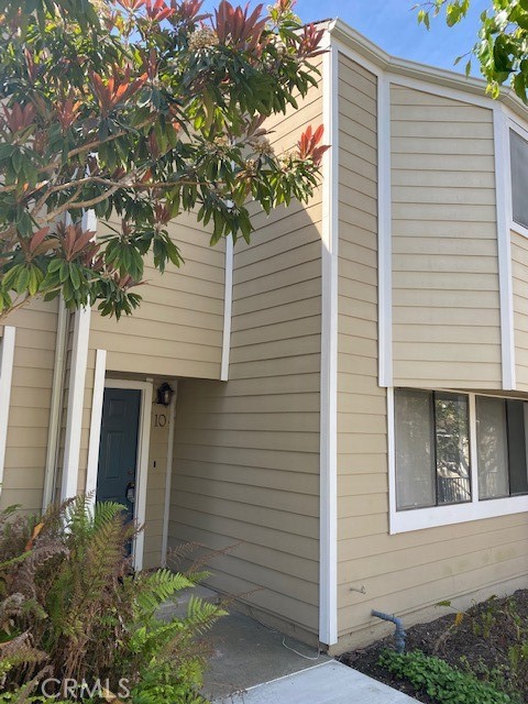 Recently remodeled. Light and bright 3 bedroom, 3 bath two-story townhome in the lovely Newport Beach neighborhood of Newport Terrace. Downstairs you will find kitchen with breakfast bar, dining room, refrigerator included, inside laundry with washer and dryer included, walk-in pantry, living room with cozy fireplace and 1/2 bath. Upstairs is the Ensuite master bedroom with vaulted wood beam ceilings, plus another full hall bathroom and two secondary bedrooms. Enjoy your private back patio with direct access to your single car enclosed garage and single covered carport. Enjoy wandering the trails of Fairview Nature Park, kick back at the sparkling community pool or bike to the beach. Small dog may be approved on a case by case basis with an additional pet deposit. Available July 20,2025.