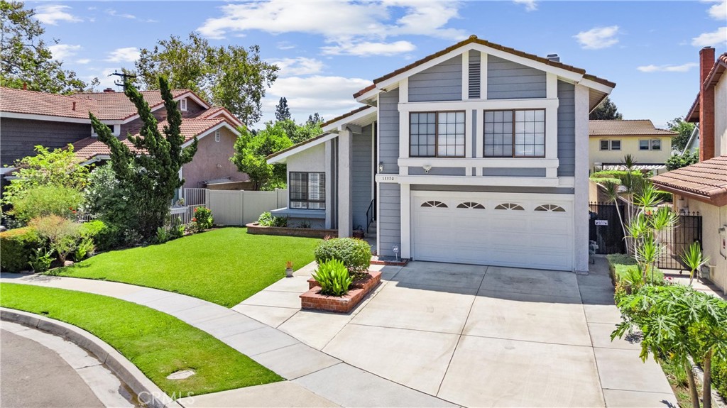 The Perfect Blend of Location, Comfort and Lifestyle in Cerritos. Located on a quiet cul de sac near Cerritos Park East, this 4-bedroom, 3-bathroom home offers 2,436 square feet of living space on a 6,032 square foot lot in the ABC Unified School District. The bright formal living room features soaring ceilings and flows into a dedicated dining area. The kitchen offers granite countertops, a gas cooktop, stainless steel dishwasher and abundant cabinetry, opening to the family room with a tile fireplace, wood floors and sliding doors to the covered patio. Upstairs, all bedrooms are spacious including the primary suite with fireplace, office nook, walk in closet and dual sink vanity. The backyard includes a covered patio with ceiling fan, fruit trees, vegetable garden space and lawn for outdoor entertaining. Additional features include an attached 2 car garage, separate laundry room and fresh landscaping. Close to Whitney High School, parks, shopping, dining and freeways.