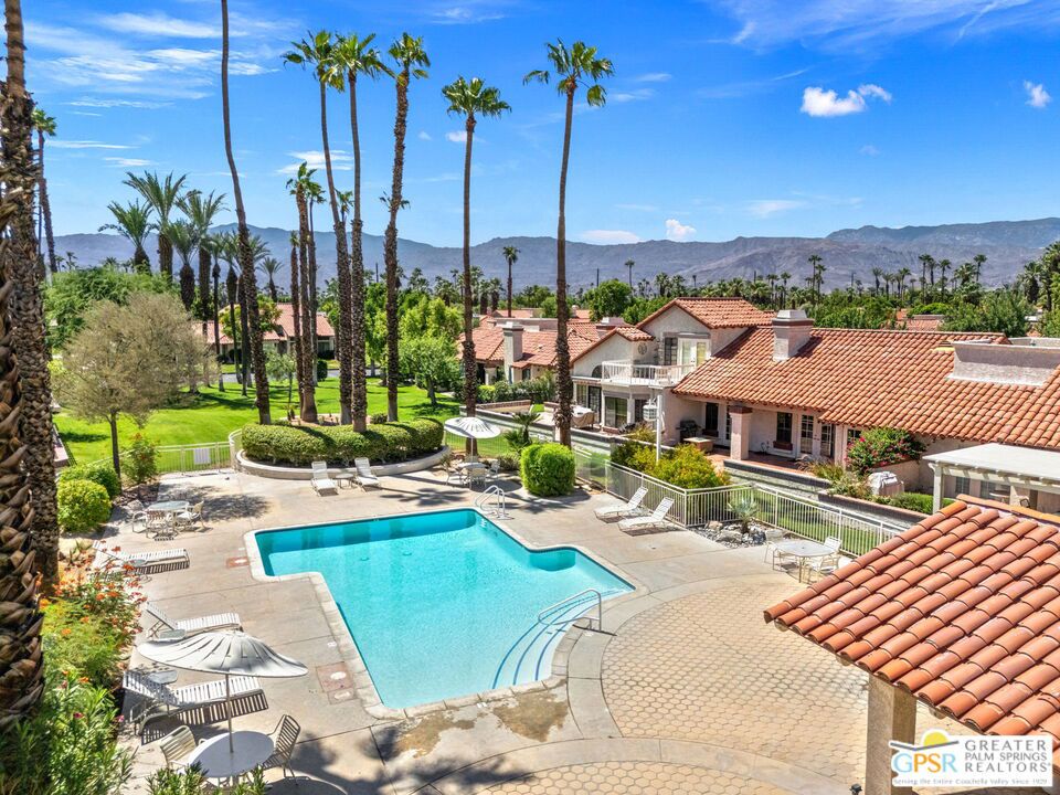 Beautifully positioned in Desert Falls Country Club, this spacious single level, single story 2BD/2BA condo with modern finishes celebrates soaring beamed ceilings, natural light, and seamless indoor-outdoor living. You will love the plank-style ceramic tile, solar shades, custom valances, and solid-core wood doors plus two patios and a central atrium to create a bright, inviting flow! Five sets of French doors open to outside areas and an east-facing terrace that is steps from a resort-style pool and spa. Your evenings will glow with poolside ambiance! The living room features a vaulted ceiling, fireplace, and wet bar while the open kitchen showcases stylish finishes, brushed nickel hardware, and a breakfast nook that opens to the gated courtyard. A dining room off the kitchen also opens to the outside, enhancing the flow for entertaining. The primary suite enjoys vaulted ceiling, patio access, and atrium views with Trex decking and new cover. The primary ensuite bath includes a large, tiled shower and dual vanities. The guest bedroom with full bath also opens to the courtyard. Pride of ownership extends to the 2-car garage with custom cabinetry. Fee Simple land and some of the lowest HOA dues at Desert Falls Country Club add appeal, along with resort pools, fitness, pickleball, tennis, and a championship golf course rated top 10 by the SCPGA and 4 stars by Golf Digest. Take the Matterport Virtual Tour for the full experience!