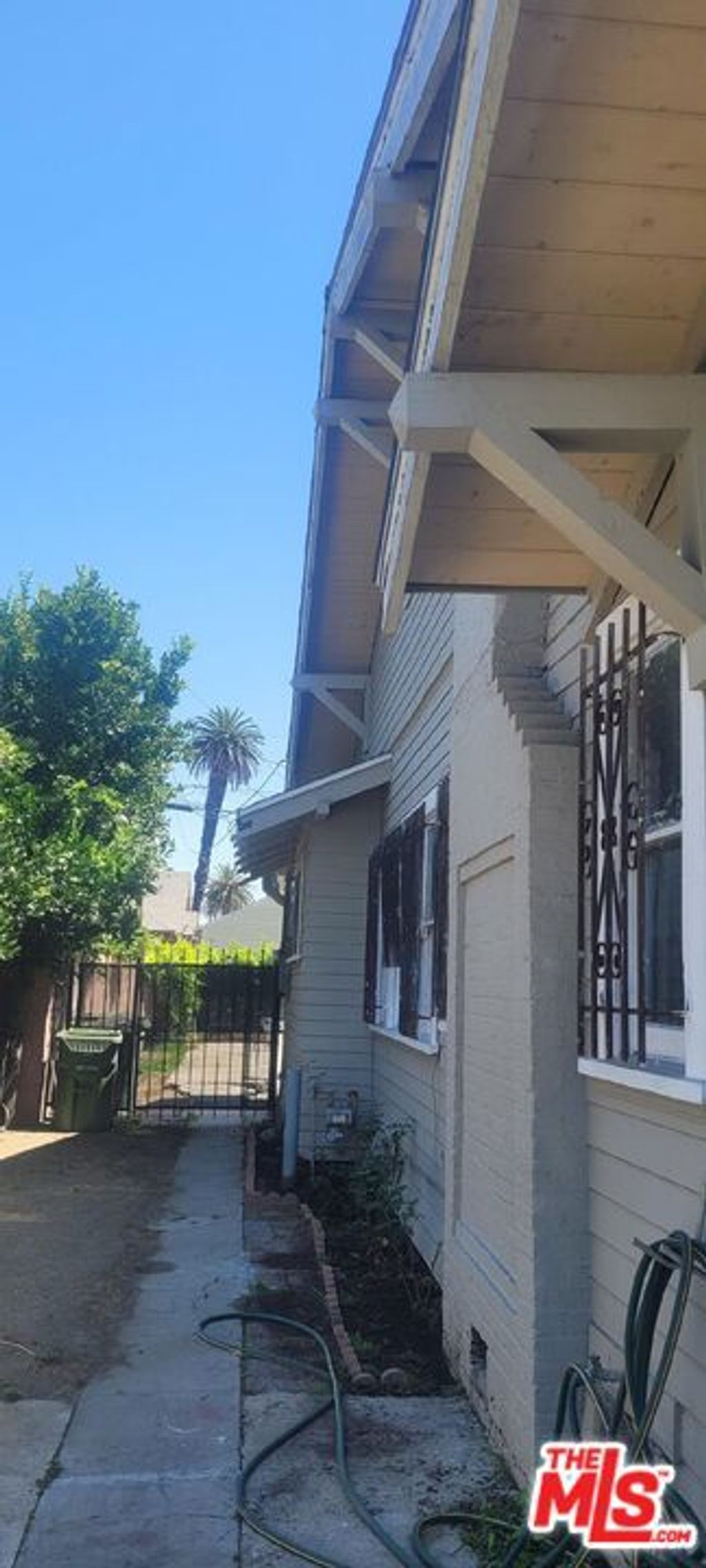Photo of 5102 Cimarron Street, Los Angeles, CA 90062 (MLS # 25584081)