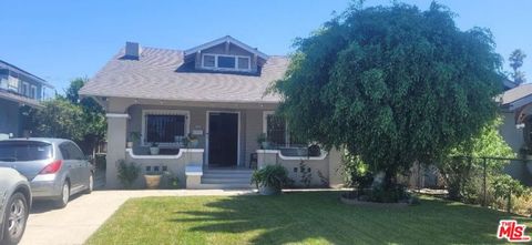 Photo of 5102 Cimarron Street, Los Angeles, CA 90062 (MLS # 25584081)