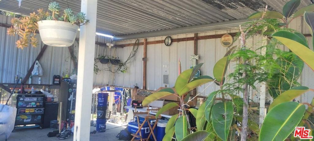 Photo of 5102 Cimarron Street, Los Angeles, CA 90062 (MLS # 25584081)