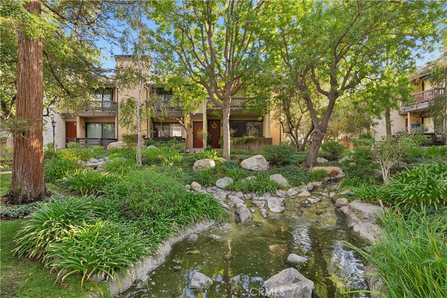 Welcome to Warner Village, where your dream tri-level townhouse awaits! This charming end unit boasts three spacious bedrooms and two and a half bathrooms, perfectly designed within an open floor plan that spans 2,022 square feet. Located in a tranquil location, you’ll enjoy picturesque views of  serene streams, and refreshing pools with running water right next to the front door.  Step inside to discover a bright living room featuring high ceilings and a cozy fireplace. The kitchen is a chef's delight with elegant granite counters, a delightful balcony, and a convenient eating area. Entertain guests in the formal dining room that leaves a lasting impression. The upstairs bedrooms are generously sized, with the primary bedroom offering a luxurious walk-in closet and its own private balcony. Plus, a versatile utility room provides the perfect space for an office or guest room. The HOA includes water earthquake insurance cable and the internet. The B tax rolls indicate 1,631 square feet, however the builder floor plan was measured as 2022 Sq Ft including the bonus room. Buyer to verify the square footage. One year old air conditioner. New electrical panel. Enjoy the shopping,restaurants,parks and easy access to nearby freeways and beaches.