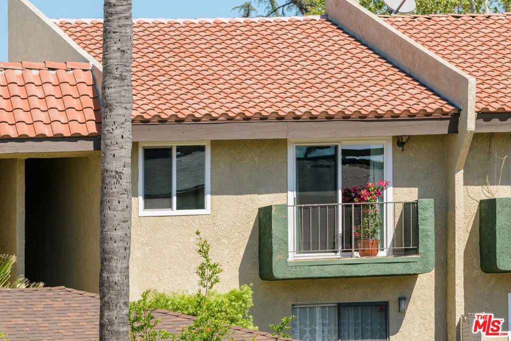 Photo of 7439 Woodman Avenue #25, Van Nuys, CA 91405 (MLS # 26665287)