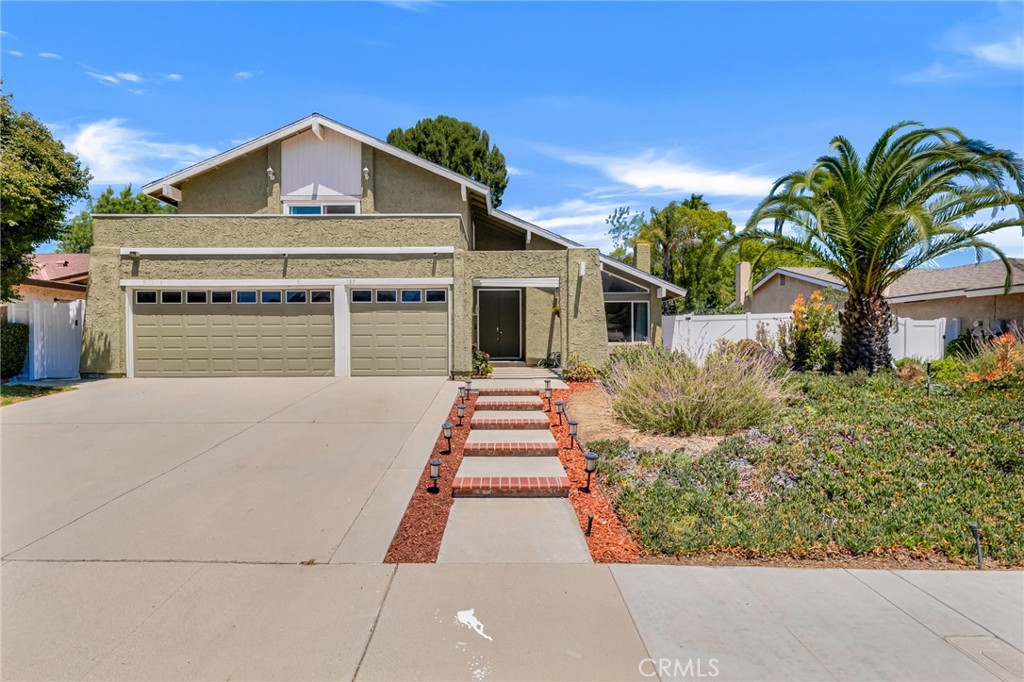 Welcome to this Sweet Home in the highly desirable neighborhood of Newbury Park, where gentle ocean breezes bring a cooler, more comfortable climate surrounding the high-rated schools. This beautifully maintained and upgraded two-story home with 4 bedrooms and 3 baths combines comfort and style with energy independence, featuring a fully owned solar system installed in 2021 with net metering 2.0 that has a much higher rebate rate than NEW 3.0 and two Tesla Powerwalls that provide uninterrupted power—even during outages. Step inside to discover a thoughtfully designed layout featuring high ceilings in the living room, recessed lighting, and elegant hardwood floors throughout. Dual-paned windows allow for abundant natural light. Upstairs, you’ll find four bedrooms, including a spacious master suite that opens onto a private balcony with stunning views. The balcony floor has been recently updated, combining both elegance and durability. Downstairs, there is a versatile office space that can easily be transformed into a fifth bedroom, home office, gym, or guest suite, adapting perfectly to your lifestyle needs. Also a bright and private living space features a large sliding glass door to the backyard for natural light and this area can be fully enclosed with a sliding barn door, offering both privacy and flexibility. The open-concept kitchen boasts abundant counter space and a functional layout, perfect for meal prep and entertaining. The outdoor space features a drought-tolerant landscape that offers stunning curb appeal and water-wise gardening. It has been upgraded with a new fence, a sand fire pit, and solid concrete flooring—ideal for outdoor gatherings. It is close to transportation, shopping, markets, parks and restaurants. This delightful home provides excellent accessibility and everyday convenience.