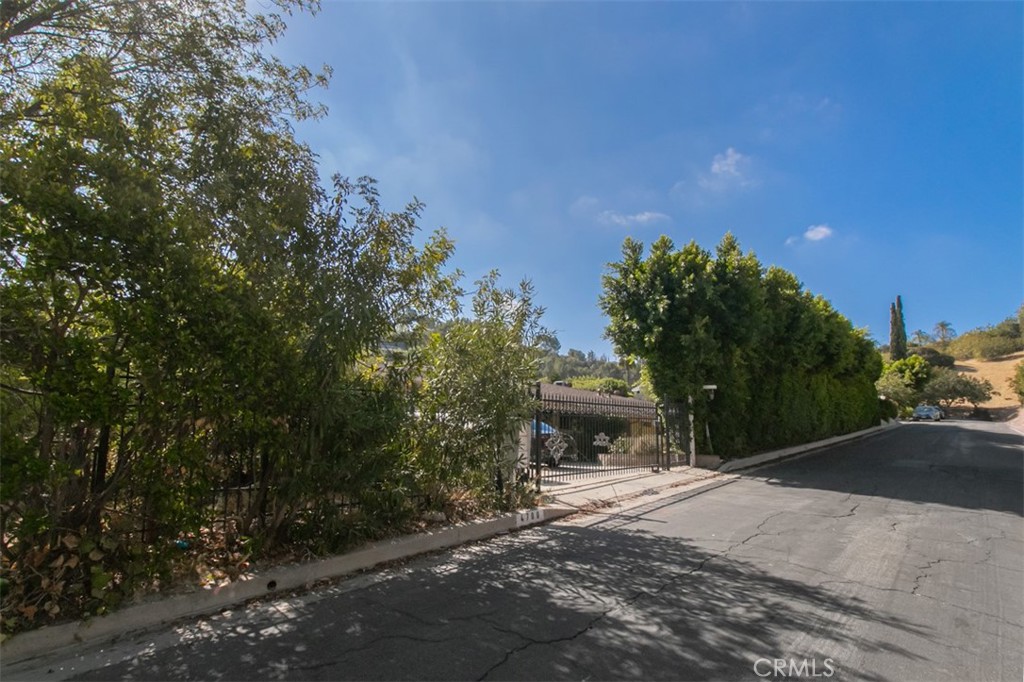 ATTENTION BUILDERS AND INVESTORS! – Prime Tarzana, South of the Blvd with Expansive Views! Located in the highly desirable hills of prime Tarzana, this rare offering presents an exceptional opportunity for investors, developers, or end-users looking to build or renovate in one of the most sought-after neighborhoods. Situated south of the boulevard on a quiet, upscale street, this property boasts a massive 17,000+ sq ft lot, offering ample space for a luxury estate, guest house/ADU, pool, and more. (buyer to verify.) Perched above the street, the lot enjoys beautiful hillside views, excellent privacy, and is surrounded by multi-million dollar custom homes making it a compelling option for those looking to capitalize on the area's high resale values. Whether you're envisioning a ground-up new construction, a major remodel, or simply holding for future appreciation, this property delivers the location, lot size, and potential to make your vision a reality. Close to top-rated schools, high-end shopping, dining, and easy freeway access, this is truly a rare development opportunity in a prestigious Tarzana enclave.