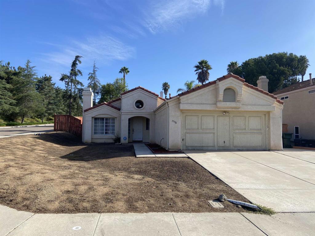 Fantastic home in a highly sought after neighborhood. Needs a small amount of work to be the home of your dreams! This large corner lot features low maintenance landscaping, privacy, and a blank slate. Walk into a bright and open living area with beautiful french doors leading outside, a large kitchen with eating area. Inviting fireplace in the family room and a long hallway leading to 3 large bedrooms and 2 full bathrooms. Built in shutters, give you the privacy you need while letting in an abundance of light during the day. 2 car garage with washer/dryer. Massive, fenced yard.