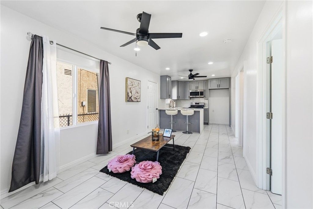 Photo of 1118 E 77th Pl, Los Angeles, CA 90001 (MLS # DW26066982)