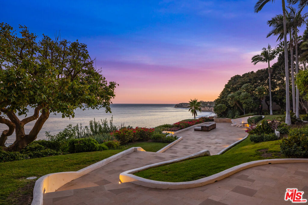 A true once in a generation opportunity to acquire one of Malibu's most beautiful oceanfront estates in Paradise Cove. Located in Malibu's most exclusive private gated enclaves, situated on 6.7 magnificent acres overlooking spectacular head-on ocean views. A long private driveway leads to a beautiful Mediterranean estate surrounded by magnificent gardens, tall walls and stunning views of the Pacific Ocean and a secluded private beach paradise. This beautiful estate is one of Southern California's most significant properties, which opens to a grand 2-story foyer, an incredible living room with soaring ceilings, a gourmet kitchen with a breakfast room rotunda and large family room, a full movie theater with state-of-the-art electronics, stunning primary suite, two offices, gym, and much more. Spectacular grounds include a resort-like swimming pool, north/south lighted championship tennis court and guest house. Featuring your own private path and walkway to one of the most incredible beaches in the world. Shown to pre-qualified clients only.