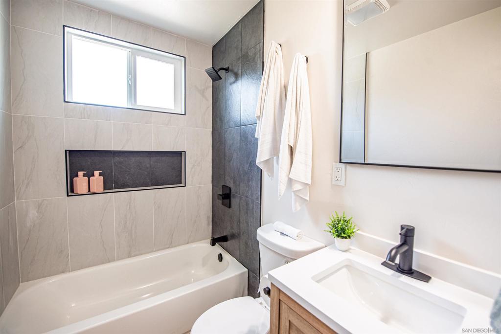 Beautifully renovated home on the cusp of Spring Valley and lemon Grove. Open concept living includes: Custom kitchen cabinets, waterfall edged countertops, new stainless steel appliances, primary en-suite with modern designer tile, brand new roof and more. Oversized backyard with fruit trees, water conserving landscape and a large shed. Quick access to the freeway's, school's, and multiple shopping centers.