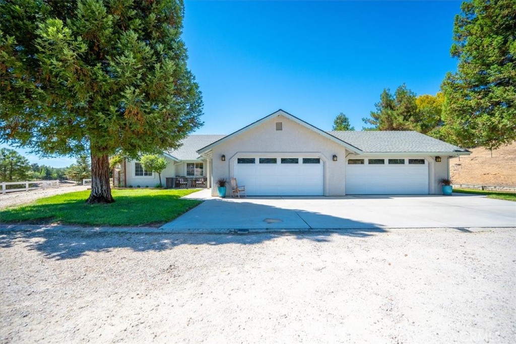 This one checks all the boxes. Set on 2 usable acres, this 4-bedroom, 2-bath home offers 2,000 square feet of well-planned space, a 4-car garage, an additional outbuilding, and plenty of room for hobbies, storage, and future expansion. Inside, the heart of the home features a spacious living room with a wood-burning stove insert, perfect for cozy evenings. The kitchen is outfitted with Bosch appliances, a walk-in pantry, and a full water filtration and softener system — everything you need for daily living and entertaining. The layout offers great flow, with four comfortable bedrooms and two remodeled bathrooms. The standout primary suite includes backyard access, dual walk-in closets, and a spa-like bathroom with marble floors and shower, a cast-iron pedestal tub, and dual sinks. Outdoors, there’s plenty of room to spread out. An RV dump station, mature landscaping, white wooden fencing, and a large outbuilding with a roll-up door make this property ideal for anyone with toys, tools, or big plans. There’s even easy access to the backyard for a potential ADU or a large shop. Whether you’re stargazing at night or tinkering in the garage during the day, this home offers flexibility, space, and serious potential. It’s packed with features you don’t want to miss — call your Realtor today to see it in person.