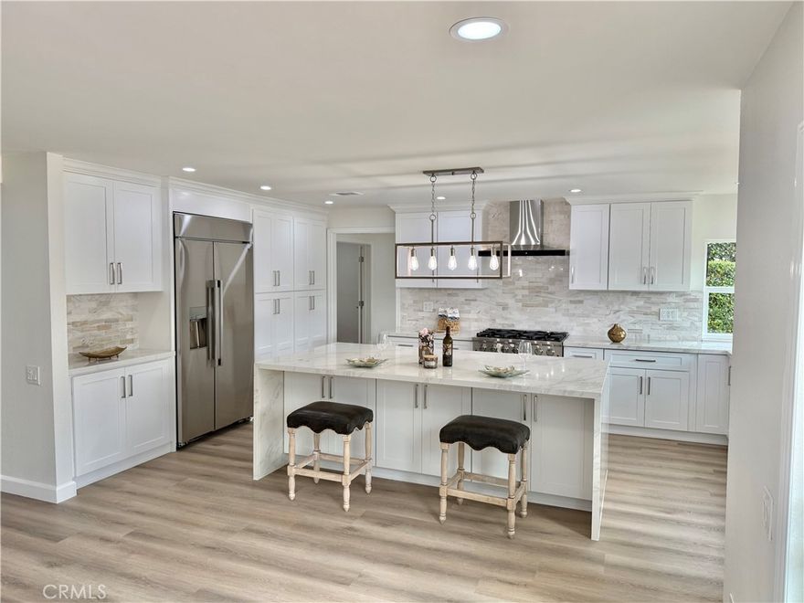 NEW! NEW! NEW! Remodel just completed. The following items are new: Built in refrigerator, kitchen cabinets, quartz counter tops, vinyl plank flooring, dishwasher, range, microwave, faucets, light fixtures, new paint inside and out, outlets and light switches etc. etc. Remodeled bathrooms. Shows like a model. Lake privilege's. Welcome to your beautiful two-story residence nestled in the heart of Mission Viejo. As you step through the double doors, a magnificent curved staircase and soaring vaulted ceiling greet you, inviting you into a home of warmth and possibility. This cherished Madrid home boasts five bedrooms – four bathed in sunlight upstairs, and one downstairs perfect for guests or a quiet retreat. At the heart of the house lies a spacious kitchen, where meals become lasting memories and families find their rhythm in shared moments. The large family room has a cozy fireplace, a formal dining room, and an inviting family area that offers spaces for connections and joy. Upstairs, you’ll find the large main suite with a grand entrance, a spacious sitting area, and an outdoor patio deck to relax and enjoy the views. The master bath has an oversized tiled shower, his and her closets, and a double vanity. A spacious laundry room provides convenience with hookups for a full-size washer and dryer. The front and rear patios showcase beautifully manicured lawns, perfect for entertaining or savoring quiet moments with family and friends. The home is just a few minutes away from Lake Mission Viejo. The lake association presents sandy beaches, volleyball and basketball courts, fishing spots, picnic areas, and rentals for kayaks, pedal boats, and party boats, ideal for sunset cruises with loved ones. Conveniently located near schools, golf course, park, shopping, dining, and the I-5 Freeway. Welcome to your new home!