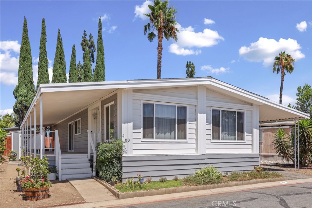 This mobile home is in the Sierra Pines all-ages community park. The home features laminate flooring throughout the house, newly painted kitchen cabinets, upgraded kitchen counter tops, new upgraded windows, 2 bedrooms (with ceiling fans), 2 full bathrooms (upgraded master bathroom) and an additional room that can be used as an office or small spare room. The home also features a covered carport that will fit two cars and includes two sheds for additional storage. The sale includes the refrigerator and washer/dryer. The community amenities include a swimming pool, jacuzzi, and a clubhouse.