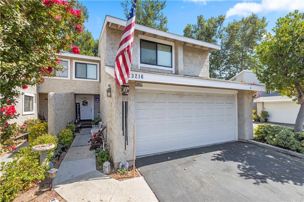 Prime location in the heart of Valencia. Welcome to the Vista Valencia Townhomes with No Mello-Roos and low HOA, a beautiful gated community. This corner lot home includes 3 bedrooms, 3 bathrooms, with a loft, spacious backyard, and 2 car attached garage with 1,921 Sq.Ft. of living space. Enter this home and instantly notice the open floor plan and cathedral ceilings flowing right into the living room fireplace with a beautiful view of the private backyard. Downstairs bedroom or office with dual access and attached bathroom, spacious upstairs loft with a closet, nice sized upstairs bedroom, and a huge master bedroom with high ceilings. Some of the highlights include new roof, whole house fan, new inside doors, new kitchen appliances, new windows, recessed lighting, newer central air, and much more! Garage has new cabinets with tons of storage, HOA includes water, green belt maintenance, swimming pool, jacuzzi, meeting room, security patrols and guest parking. Close to shopping, award winning schools, freeway access, post office and restaurants! Welcome Home