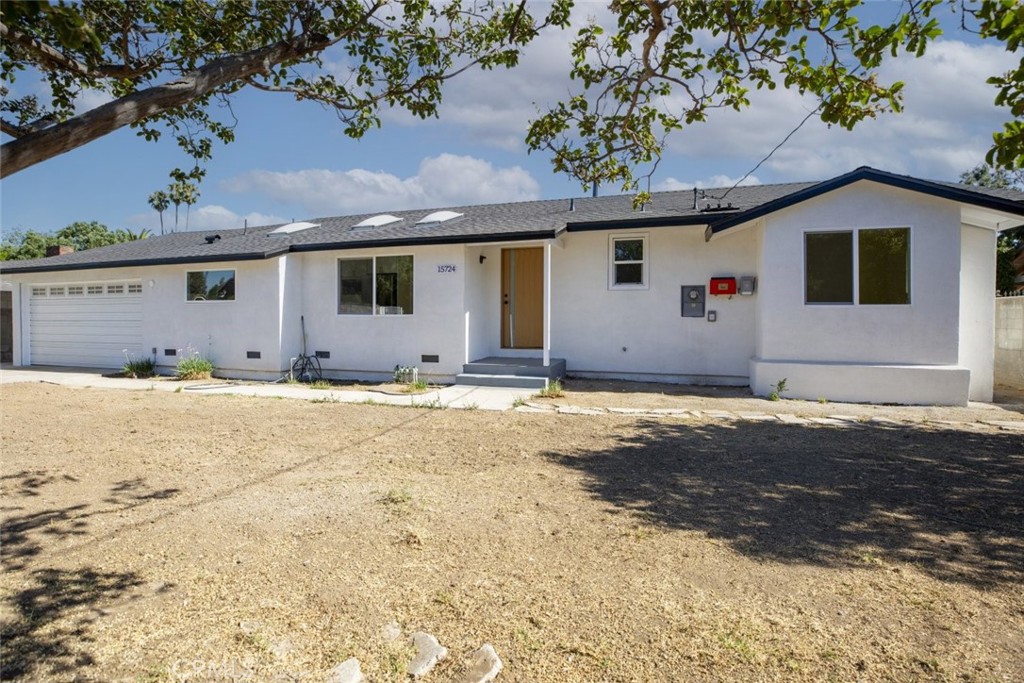 Welcome to 15724 Chase St in North Hills CA 91343. This beautifully remodeled single story home offers 3 bedrooms and 2 bathrooms across 1424 square feet of elegant living space on an oversized 18644 square foot lot. With modern finishes bright open living areas and exceptional outdoor space this home is a rare opportunity in a sought-after neighborhood. As you enter you are welcomed by a light-filled open concept floor plan that blends style and function. Large windows invite an abundance of natural light that fills the living and dining areas creating a warm and inviting atmosphere throughout. The updated kitchen features a spacious island ideal for cooking or entertaining a French door refrigerator quality appliances and generous cabinet storage for all your needs. Each of the three bedrooms is well-sized with thoughtful updates and the remodeled bathrooms feature modern finishes and clean design. Recessed lighting updated flooring and contemporary touches add to the home's turnkey appeal. In the back yard enjoy mature lemon trees and a vast open space perfect for entertaining relaxing or expanding. Whether you dream of gardening building an outdoor the possibilities are endless. The expansive lot also includes a durable metal carport or open-sided garage structure that offers flexibility for use. It can serve as a workshop storage for equipment or vehicles a utility shed or shelter for tools and supplies. The property includes an attached 2 car garage and an in-home laundry area with washer and dryer for added convenience. Located on a quiet residential street with close access to schools shopping dining and freeways this home offers the perfect balance of privacy and accessibility. This is your chance to own a fully upgraded home with a rare lot size and space to live grow and create. Schedule your private tour today.