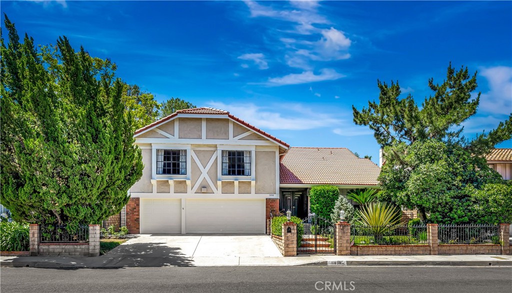 Welcome to your dream home in the desirable Porter Ranch community, where elegance meets comfort. This beautifully appointed residence features an entertainers floorplan with 4 spacious bedrooms and a Large Bonus/Game Room. The dramatic entry with vaulted ceilings that invites you into a spacious, sun-drenched living space. Gleaming hardwood floors sweep through the main areas, creating a warm and inviting atmosphere. The heart of this home is the expansive kitchen and family room combination—perfect for gathering with loved ones or entertaining guests. The seamless flow leads you to a low-maintenance backyard oasis, complete with a sparkling pool and surrounded by meticulously maintained lush landscaping that offers both beauty and privacy. Retreat to the spacious master bedroom that boasts a recently updated ensuite bathroom. Step out onto your private balcony with a nice view of the rooftops and overlooks the enchanting backyard, making it the perfect spot for morning coffee or evening sunsets. Also upstairs are 2 other bedrooms and a enormous Game room which if a perfect entertainment s[pace or kids play room. This home effortlessly combines indoor and outdoor living, providing a serene escape just moments away from the vibrant Porter Ranch community