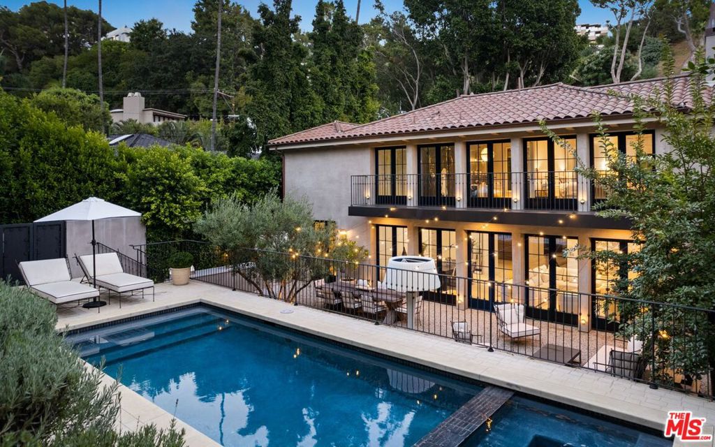 Welcome to Chateau Doheny, located in the lower Bird Streets this home was built with quality and attention to detail rarely found in homes on the market today. Upon entry you are greeted by a stunning courtyard with a limestone fire pit and fountain imported from France. The interior of the home boasts soaring ceilings, Venetian plaster walls, limestone flooring and French doors that open to a stunning and serene backyard with an outdoor dining area, pool, spa and separate terrace with city views. The kitchen features an Officine Gullo range imported from Italy, Miele and Wolf appliances, wine cooler and Calcutta Marble countertops. Upstairs, there are two en-suite bedrooms, including the incredible Primary Suite with dual balconies, fireplace, and city views including Century City. The Primary bathroom is oversized with two closets and Greystone marble. On the main floor, there are two nicely appointed bedrooms with en-suite baths and a large family room off the kitchen. Downstairs, there is a gym or additional living space plus the fifth en-suite bedroom with a separate entrance. This is a truly exceptional home that offers everything you could want in a luxury residence. It is located in a prime location, has stunning views, and features top-of-the-line finishes and amenities. A property of this caliber and location will be appreciated by the most discerning buyer.