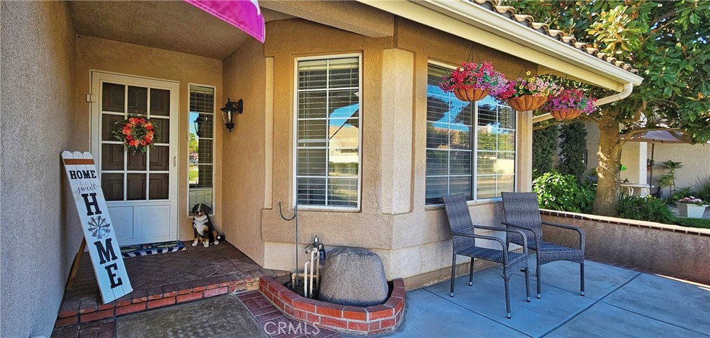 This exceptional turnkey home is located within the 55+ Sun Lakes Community. The property offers a bright, open-air floor plan with high vaulted ceilings and a spacious living room featuring a fireplace. The residence includes three bedrooms and two full baths. The primary bedroom provides ample closet space and private access to a custom-covered back patio. New flooring has been installed throughout, while the kitchen features granite countertops and updated cabinetry, seamlessly connecting to a dining area with views of the landscaped backyard. Outdoor enhancements include custom concrete work, brick planters, and solar lighting. Residents can enjoy a mountain view with no rear neighbors. The front courtyard is ideal for social gatherings. Sun Lakes Country Club amenities include two private golf courses, three clubhouses, tennis courts, three swimming pools, a restaurant/lounge, ballroom, and more. This property represents an outstanding opportunity for discerning buyers.