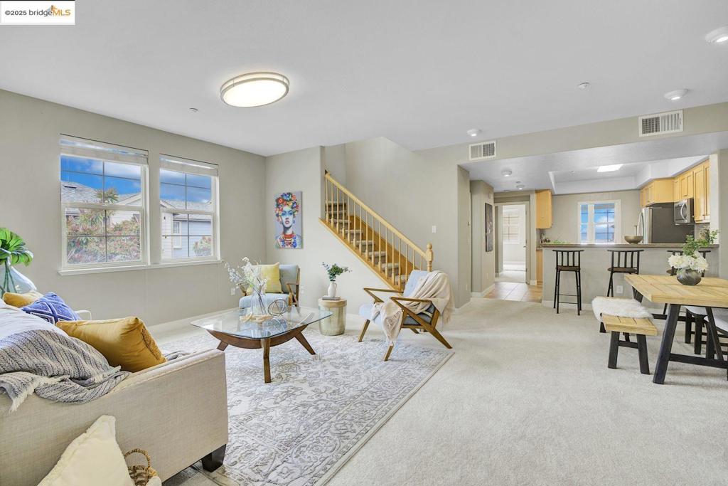 Peaceful living with stunning Oakland Hills views awaits you at 6130 Old Quarry Loop. This spacious townhome-style condo features two primary suites and a bonus room for an office or third bedroom, along with three full bathrooms. The kitchen is ready for anything with stainless steel appliances and granite counters. A private two-car garage and in-unit laundry add to the convenience. Its prime location just off Highway 580 makes commuting simple, keeping you connected to OAK, the Oakland Zoo, Lake Merritt, and downtown Oakland.