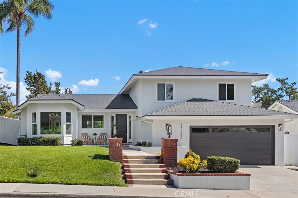 Welcome to this one-of-a-kind, professionally custom redesigned home with top quality finishes centrally located to schools, parks, shopping and freeways. All construction in this home has been fully permitted and inspected by the building department of the City of Mission Viejo. With four bedrooms, including two primary ensuites, and four bathrooms in roughly 2400 square feet and an oversized backyard this home has it all. Nearly everything in this home is brand new including: New roof, complete restucco, Pex plumbing, HVAC ducting, electrical wiring, tankless water heater, Milgard dual pane vinyl windows, quartz counter tops throughout the house, luxury vinyl, marble and tile flooring, soft close custom cabinets and drawers, new appliances, plumbing fixtures and so much more. The kitchen includes a large island, custom cabinetry with designer pulls and opens to the great room and adjacent formal dining room. The dining room features a built-in buffet with beverage refrigerator and a large bay window. The living space opens to the backyard for easy indoor/outdoor entertaining. Each of the ensuite primary bedrooms feature dual sinks and oversized showers. The main floor primary bedroom boasts a huge walk-in closet and has access to the backyard. The marble bathroom has a separate toilet room for added privacy. Enjoy the convenience of an indoor laundry area. The extra wide garage has a new garage door opener, epoxy floors, new drywall and EV hookup capability. For two nominal fees the HOA’s offer exclusive access to Mission Viejo Lake and Mission Viejo Swim and Racquet Club which is walking distance from the home, for endless outdoor recreation.