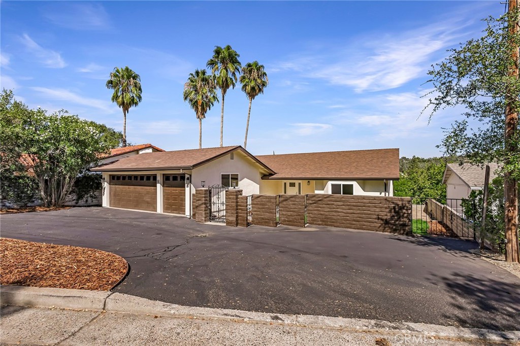Motivated Sellers!
Welcome to this stunning, turn key, fully remodeled, 4 bedroom, 3.5 bath, 3 car garage home! From the paint, flooring, fixtures, appliances, windows, doors, etc., everything is brand new! Boasting four spacious bedrooms and contemporary finishes throughout, this residence blends modern elegance with comfortable living. The main floor features two bedrooms, one being a master bedroom with a large en-suite bathroom and walk-in closet and the other has a cute bay window with a full bathroom just down the hall. The completely remodeled kitchen features new cabinets, quartz countertops, and high end appliances. In addition to the kitchen nook there is also a large dining area, perfect for entertaining. This home offers two living rooms on the main floor giving you plenty of space and options. One has access to the deck and offers incredible views and the other sits off of the kitchen with a beautiful fireplace insert. There is also a laundry room, a half bath, and plenty of storage on the main floor. As you walk down the beautiful new staircase you will find a whole other space for entertaining! There are two large bedrooms and a full bath. The space in between the bedrooms can be used as another living room or game room with access to the patio, and the highlight downstairs is the mini kitchen ready to go with a sink and mini fridge. In addition, there is a second laundry room downstairs for convenience. The front yard has been landscaped with new sod, a automated sprinkler system and fresh bark. You really need to see this home in person to see all of the incredible details that went into this home!