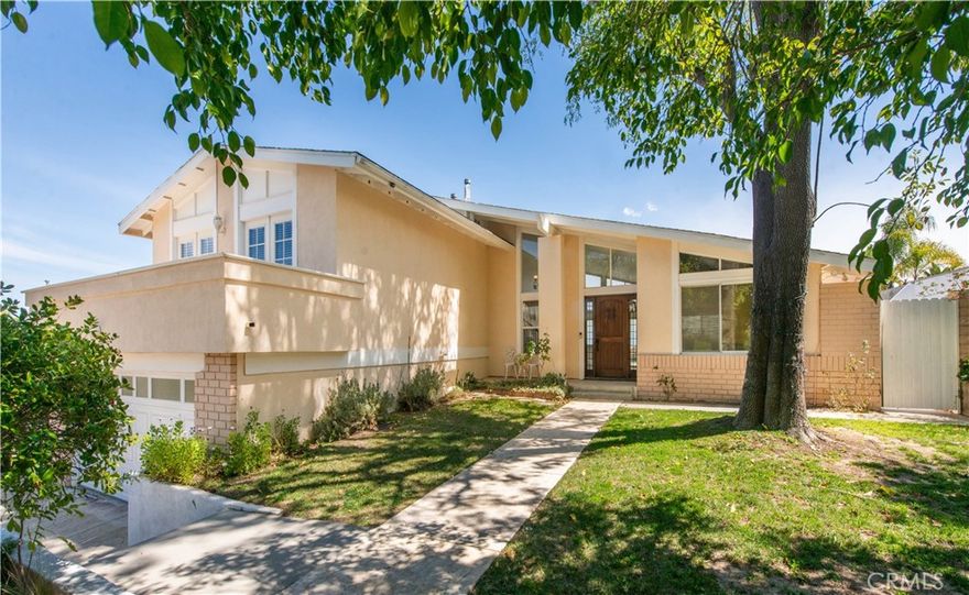 Panoramic view property with a large flat yard. Located in the one of the most sought after locations in Tarzana you will find a beautifully remodeled 5 bedroom, 3 bathroom home. The family friendly 4 bedroom upstairs, 1 downstairs layout is made even better by with the presence of the park like yard and panoramic views seen immediately as you enter this home. The backyard is huge, has a large infinity pool and spa and a large side yard! The gorgeous, recently remodeled kitchen is ideal with its open plan, granite counters and stainless steel appliances. Bathrooms were also recently remodeled with custom tile and stone work and contemporary vanities. Available for immediate occupancy.