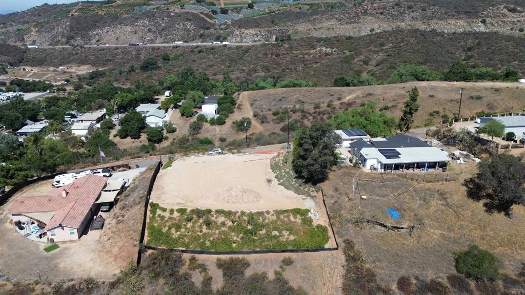 Attention builders and contractors—this is the opportunity you’ve been waiting for! This .92-acre parcel in North Escondido is truly ready for construction. All the hard work has been done for you: fully approved plans for a 3-bedroom + office, 2-bath, approximately 2,000 sq. ft. home, building permits in hand, and a graded, certified pad. The septic system and water meters are already installed, and all permit and school fees have been paid. Enjoy sweeping views and a prime location with convenient freeway access. Lots like this—where you can break ground immediately—are incredibly rare. Don’t miss your chance to bring your vision to life without the typical delays!