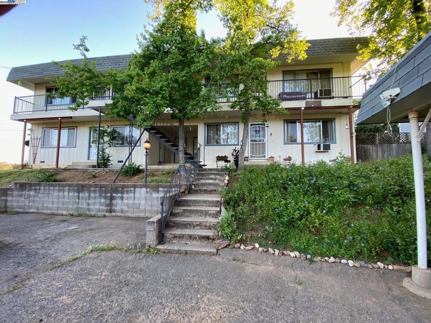 Upstairs single level 2 bedroom end unit. Eat-in kitchen includes refrigerator, new stove, and dishwasher. new carpet and paint. Private laundry and storage area. Includes washer and dryer. Small yard is a plus. Assigned carport parking. Rent includes water and sewer.  Available.