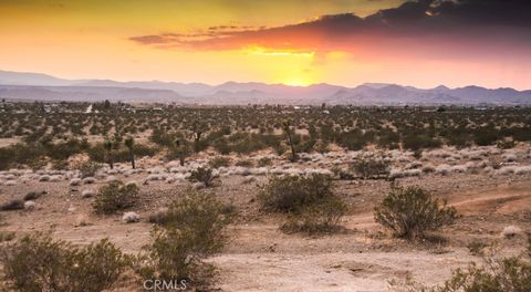 Photo of 58459 Starlight Mesa Road, Yucca Valley, CA 92284 (MLS # JT26022107)