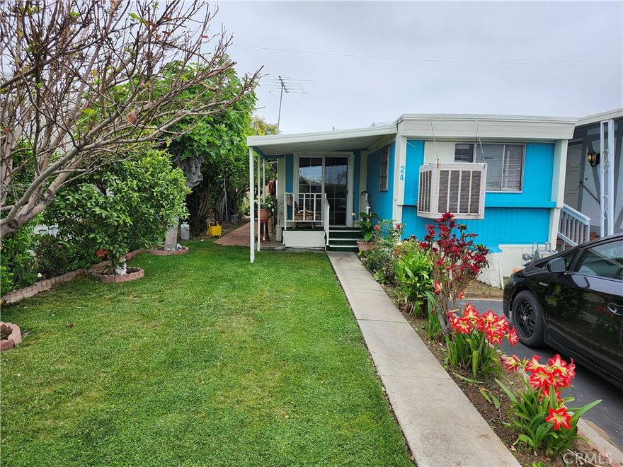 Price reduction, Priced to sell!!! -  Welcome to PARQUE a clean and quiet 55+ mobile home park.  Home features two bedrooms, one bath, covered patio, in unit laundry hookups, Livingroom, Kitchen and Breakfast Nook.  Newly remodeled Kitchen and Freshly Painted Interior.  Nicely landscaped yard with many fruit trees, (mango, orange, lemon and pomegranate to name a few).  Park has community laundry facility, club house and a sparkling pool.