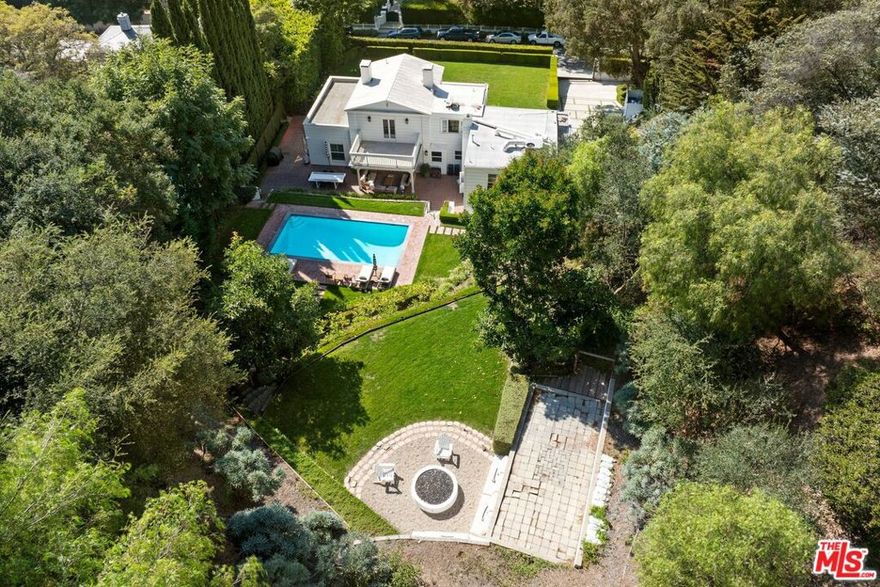 Representing a unique opportunity to build a world class estate, Stone Canyon blends natural beauty with secure elegant living. This acre+ oasis located on one of Bel-Air's most iconic streets, is within minutes of the Hotel Bel-Air and the lively urban pulse of LA. Sited above the street behind hedges for ultimate privacy. Plans included for an exceptional estate and guest house designed by world renown AIA architect Wm Hefner - rendering of front elevation in the photo section.