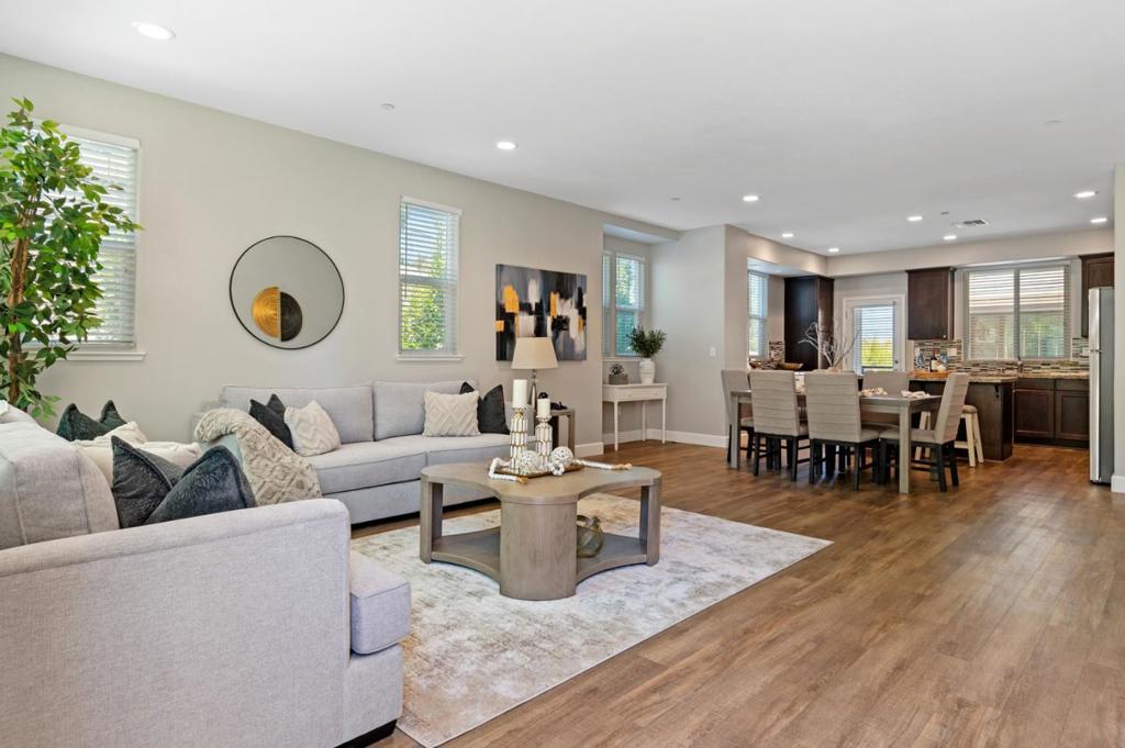 Looking for a lower ground floor Bedroom and Bath separate from Living Area and Bedrooms - possibly well suited for an Office or privacy for a family member? Check this one out! This beautifully crafted Townhome offers modern living in the desirable Villages at Arnold. Luxury vinyl plank flooring spans the main living areas, adding style and durability. On the main level, an airy great room seamlessly integrates family, dining & kitchen spaces, perfect for entertaining. Glass door to the Balcony just off the Kitchen allows for easy dining or coffee in the morning. This chef's kitchen stands out with an oversized island with bar seating, sleek cabinetry, stainless steel appliances & a gas range - great walk in pantry. This 4 Bedroom home has a unique bedroom setup with a bedroom and full bath on the ground floor. The top floor offers a private retreat, featuring a spacious primary suite with spa-like ensuite, dual sinks, walk-in closet & glass stall shower. Two additional bedrooms share a hall bath & the laundry room close by. Conveniently located near Hwy 680/ Hwy 4, this home is nicely situated close to the Concord shopping center and Downtown Martinez with coffee shops, breweries, restaurants, live music, Farmers Market, the Marina, scenic trails & highly-rated schools.
