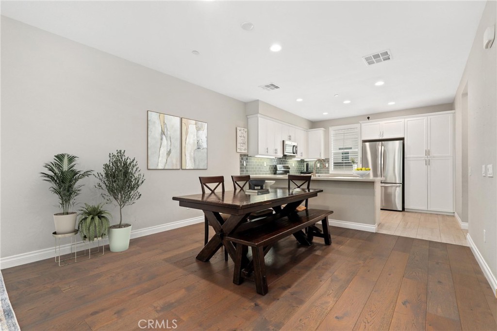 Modern Comfort in the Heart of Glendora | Gated Resort-Style Living...
Welcome to 649 W Foothill Blvd Unit 2, a beautifully appointed, solar-powered townhome located in the desirable Foothill Collection, a gated resort-style community in the heart of Glendora. With 3 spacious bedrooms, a versatile bonus room/office, and 4 bathrooms, this multi-level home offers the perfect blend of function, style, and convenience. The first floor greets you with direct access from the attached two-car garage, a flexible office or den space ideal for remote work or a guest retreat, a convenient powder room, and access to a private, fenced front patio, perfect for morning coffee or evening relaxation. Upstairs, the main level showcases an open-concept layout designed for modern living. The bright and stylish kitchen is the centerpiece, featuring quartz countertops, a peninsula with bar seating, classic subway tile backsplash, stainless steel appliances, and crisp white shaker cabinetry. Just off the kitchen is a separate laundry room and an additional half bath for guests. The spacious living and dining area boasts warm wood flooring and ample room for entertaining or everyday lounging. The top floor features all three bedrooms, including the luxurious primary suite with a walk-in closet and an ensuite bathroom equipped with a dual-sink vanity, oversized walk-in shower, and private water closet. Two additional bedrooms and a full guest bath are located just down the hall. Inside and out, this home is thoughtfully designed with comfort and efficiency in mind, from wood-grain tile in the kitchen and baths to plush carpeting in the bedrooms and energy-saving features that come standard, including solar power. The Foothill Collection offers a true resort lifestyle, complete with a sparkling pool and spa, BBQ and picnic areas, bocce ball court, dog park, and tot lot, all within a beautifully maintained and gated setting. Enjoy peaceful surroundings with easy access to top-rated Glendora schools, shopping, dining, the Metrolink station, and major freeways. Whether you're seeking space to grow, work from home, or entertain in style, this is a home you won’t want to miss. Come see why Glendora living doesn’t get better than this!