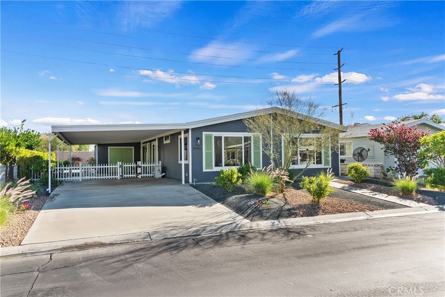 Welcome to 39700 Desert Greens Dr E, a beautifully updated 3-bedroom, 2-bath manufactured home offering 1,762 sq ft of modern and comfortable living. Fully remodeled just three years ago, this home features luxury vinyl floors, refreshed interiors, and a large open-concept living room that flows seamlessly into the dining area and kitchen — perfect for everyday living and entertaining.

A dedicated laundry room provides added convenience and extra storage. Natural light fills the home, creating a warm and welcoming atmosphere throughout.

Located in the highly desirable Palm Desert Greens, a premier 55+ guard-gated community, residents enjoy both security and an active, resort-style lifestyle. Step outside to an ample-sized backyard, ideal for gardening, outdoor dining, or simply relaxing in the desert sunshine.

Palm Desert Greens Amenities
Residents of Palm Desert Greens enjoy:

An 18-hole executive golf course
Three pools and spas
A clubhouse with restaurant and bar
Tennis, pickleball, and bocce courts
24-hour guard-gated security
Low HOA dues

Move-in ready and thoughtfully updated, this home is an exceptional opportunity to experience relaxed, modern desert living in one of Palm Desert’s most sought-after 55+ communities.